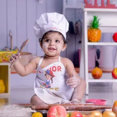 Baking up smiles with our little master chef. Our themed photoshoots are filled with fun props and endless giggles, creating memories that are as sweet as they are unique.
