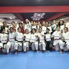 A group of empowered participants proudly holding their certificates after completing a women's self-defense workshop at my Honbu Dojo. This moment represents not just new skills learned, but a significant boost in confidence.