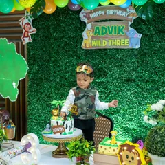 Welcome to the jungle. This little adventurer is celebrating his 'Wild Three' birthday, and we captured him enjoying his amazing jungle-themed party setup.