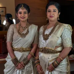 A lovely portrait of the bride's sister and mother, Ramya and her mom. I created coordinated, elegant looks for them, ensuring they both looked their best.