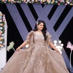 A reception look fit for a princess. This bride is wearing a magnificent golden gown, and I created a bold, glamorous makeup look with a nude lip to balance the sparkle of her outfit.
