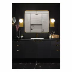 To complement the master bedroom, this bathroom is clad in black Marquina and custom white alabaster marble. The clean lines, balanced composition, and brass accents create a look of timeless luxury and sophistication.