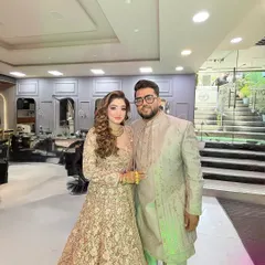 A full-length shot of the happy couple in our salon.