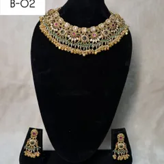 My heritage set B-02 is a classic choker with multi-color stones and pearl drops. It's a versatile piece that can be rented for weddings, receptions, or festive events.