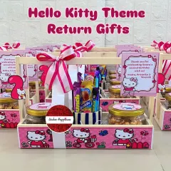 Say "Hello Kitty" to these adorable second birthday return gifts. The baskets are decorated in a pink Hello Kitty theme and filled with jars of treats and a cup of assorted candies and stationery.