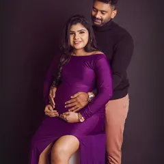 A classic couple portrait that radiates joy. The way he holds her and the baby bump is just perfection, a beautiful memory of this special time.