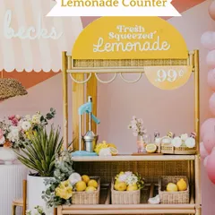 A charming and rustic Lemonade Counter. This is a perfect addition to a daytime summer wedding, offering a fresh and delightful treat for guests.