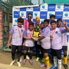 The complete Under-15 squad with their coaches after being crowned champions at the Sportyhead Premier League. A fantastic team effort from every single player.