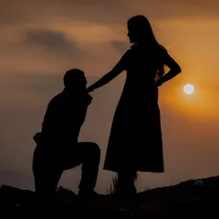 A classic proposal silhouette, with him on one knee kissing her hand as the sun sets behind them. This is a timeless and incredibly romantic shot.