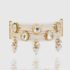 A close-up of our modern Kundan-style choker. This piece blends tradition with modernity, featuring classic Kundan stones set in a multi-layered pearl band with delicate drops.