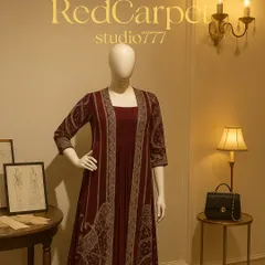 A full view of a mannequin styled in a regal maroon Anarkali with a matching embroidered jacket. This outfit is perfect for a wedding reception or a grand festive celebration.