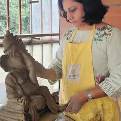 Here I am, adding the final touches to a Ganesha idol. It's a process that requires focus and a lot of love, and I feel so connected to each one I make.