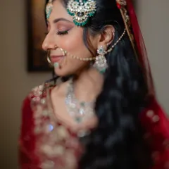 A serene close-up of the bride on her Nikaah day, capturing the delicate details of her makeup and traditional jewelry.