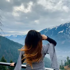 A back view of the cape dress, with my hair blowing in the mountain wind. This shot is all about capturing the feeling of freedom and adventure.