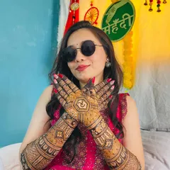 A happy bride with a cool attitude. Her sunglasses and smile, paired with her stunningly intricate mehendi, create a perfect picture of a modern bride.