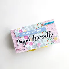 The surprise starts with the box itself. I personalize the outer box with names and themes, like this one for a birthday, giving a hint of the fun that's waiting inside.