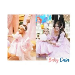 Twinning with mom on her birthday is a memory to cherish forever. We created this adorable pink party dress with a large statement bow, perfectly coordinated with her mother's gown for a picture-perfect celebration.