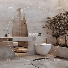 A minimalist bathroom where "less is more" is the guiding principle. The space is defined by its clean lines, wall-mounted toilet, and a unique, oversized mirror. The indoor tree adds a touch of nature and serenity.