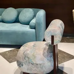 This cute and chubby slipper chair, with its unique chevron pattern fabric and solid wood legs, was customized for a hotel lobby. It’s a perfect example of how we create comfortable and stylish seating for commercial spaces.
