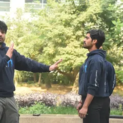 An instructor must provide clear, step-by-step guidance. In this outdoor training session, I am breaking down the initial phase of a defensive technique for students.