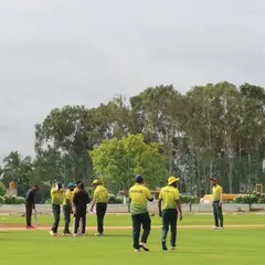 Players from two teams walk onto the field, ready for their match in the Sindoor Friendship Cup, an open-age T20 event.