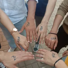 Group tattoos are a great way to celebrate friendship. I painted the word "Froog" in a beautiful script for this group of friends at a college fest.