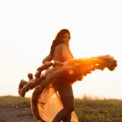 As the sun dipped lower, it created this incredible flare, wrapping her in warm light. This image feels so powerful, capturing the strength and radiance of a mother-to-be in her element.