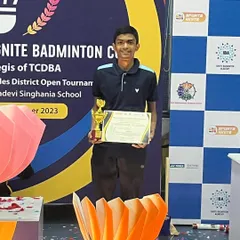 Celebrating another victory. Our player proudly displays his trophy and certificate, a testament to his hard work and the consistent support from our coaching staff.