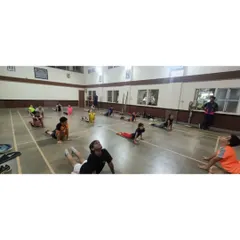 Another shot from our yoga session, with students practicing a back-bending asana. These activities help build a holistic approach to fitness.