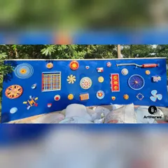 This vibrant and playful musical wall installation was created for a client in Gurgaon. It features various colorful, abstract shapes and objects mounted on a bright blue panel.