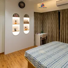 We create unique design elements like these backlit, arched wall niches. They provide a beautiful display area for personal treasures and add a soft, ambient glow to the bedroom.