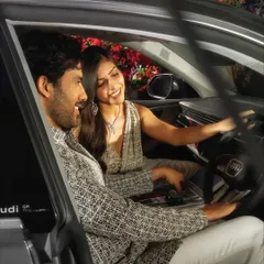 A close-up from the Audi campaign, focusing on the natural, interactive moment between the models. The makeup was designed to look fresh and authentic, even in a composed advertising shot.