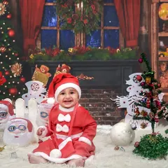 Merry Christmas from our little Santa! Our festive Christmas mini-sessions include a full winter wonderland setup to capture the holiday magic.