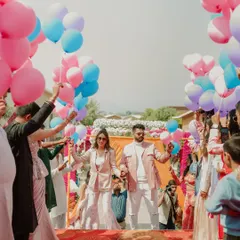 A sky full of dreams for this carnival entry. The couple walked through an aisle of friends and family holding colorful balloons, which were then released in a beautiful, celebratory moment.