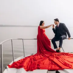 For a touch of glamour and romance, you can’t go wrong with a classic red gown. This infinity trail gown looks incredible on a yacht, creating those luxurious, cinematic shots you've always wanted.