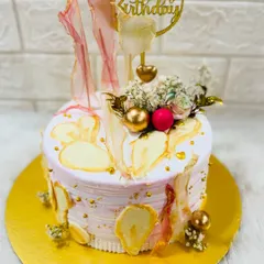 An abstract and artistic birthday cake with a watercolor effect and delicate, translucent sugar sails. A unique and modern design for any art lover.