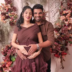 A classic and tender moment between the expecting parents. We focus on capturing the love and connection you share as you wait for your little one's arrival. This heart pose is a favorite for many couples.