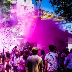Nothing beats the energy of an open-air Holi festival. Here I am, blasting pink color smoke over a massive crowd in Bengaluru, mixing high-energy beats with the vibrant chaos of the celebration.