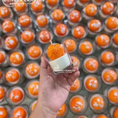 My Laddoo Candle is a bestseller for Indian festivals like Diwali and Raksha Bandhan. This image shows a single, detailed laddoo candle in a glass jar, ready for gifting.