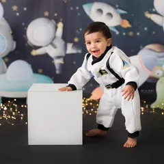 One small step for a baby, one giant leap for fun! This little astronaut is ready for an adventure in our space-themed setup, perfect for a creative first birthday.