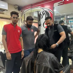 Practical experience is key. Here, our students observe and practice on a live model under the guidance of our senior trainers. This is how they build real-world skills.