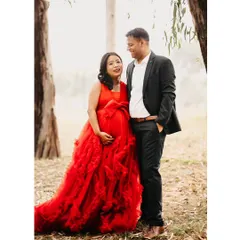A happy, candid shot of an expecting couple sharing a laugh during their outdoor maternity session. We love capturing these unposed moments that truly reflect a couple's connection.