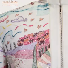A close-up of the zipper and collar detail on the landscape-embroidered Jodhpuri, highlighting the fine craftsmanship and modern construction.