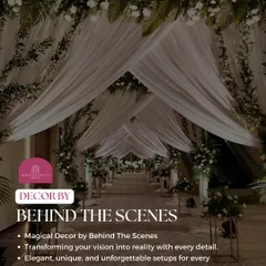 A magical entrance created by our decor team, with flowing white drapes and floral arrangements transforming the walkway into a dreamy passage.