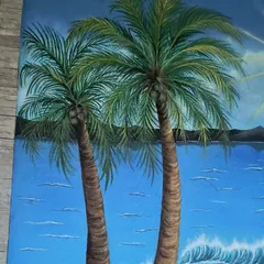 A close-up of the hand-painted palm trees.