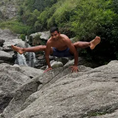 Finding stillness and strength in nature. This is what our practice is about: connecting your body's power with the peace of the outdoors, like holding a challenging firefly pose against the backdrop of a waterfall.