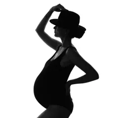 The silhouette is a powerful way to celebrate the beautiful form of motherhood. This fine art style focuses on shape and emotion, creating a dramatic and timeless portrait that is pure art.