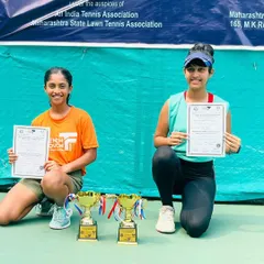 Celebrating a double victory at the All India U16 Championship Series. Eshal Pathan, at just 13 years old, proudly displays her trophies for winning the doubles title and finishing as a finalist in the singles category.