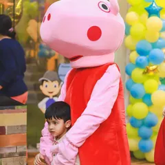 A gentle hug from Peppa Pig for one of the little guests. These special interactions are what make a Funtopia party so memorable.