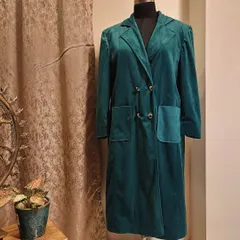 Wrap yourself in timeless elegance with this customizable suede coat in a stunning teal color. We can design your perfect winter coat together.
